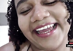 Ebony woman with a large butt and large breasts giving her butt to a white stud.