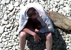 Hung uncut wank at beach