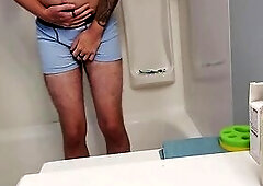Despairing Youthful Dude Boxer Pissing in Shower