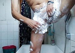 Guy gets a close-up shave in the shower before a big finish