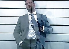 Gorgeous hunk in a suit strips and shows off that amazing body