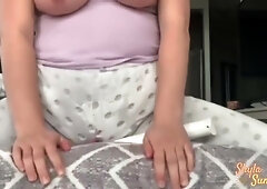 Full-figured woman stages a morning solo show with toys in view of the apartment window