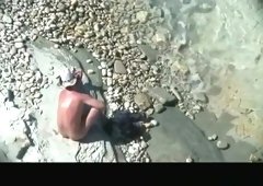 Mature nudist couple spied in rocky beach