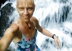 Alexa Cosmic swimming in pretty waterfall wearing colorful combi costume...