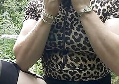 Tranny Holly smoking and playing with her cock in the woods