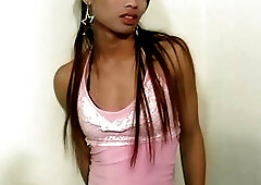 Skinny ladyboy in sexy black lingerie is posing her big cock