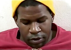 Black thug tugs his pole