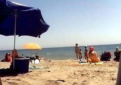 Nudist beach voyeur shoots a sexy mature lady with big boobs
