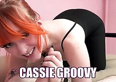 Orange haired girl Cassie Groovy lies in front of Logan in her taut ebony catsuit, and goes down on the geek's wang until this chab fills her thr