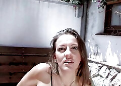 A brunette hair shows her snatch at the sun