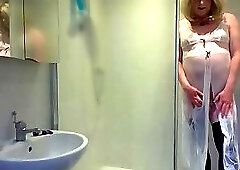 Blonde in black stockings and negligee in the shower