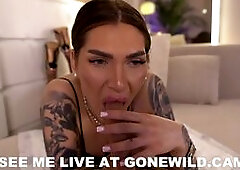 Tattooed Babe Sucks Dildo Tease