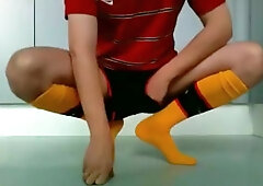 Stroking in Arsenal soccer outfit