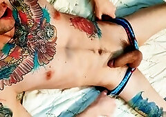 Inked guy drains his balls