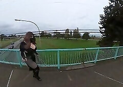 Crossdresser flashing on a highway bridge