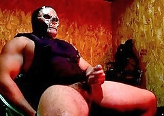 Buff guy in uniform giving himself a handjob with his massive cock