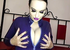 Princess18 in a glossy purple latex suit teases with her feet and reveals a jeweled butt plug