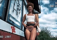 Young ebony model poses for edgy street photography session