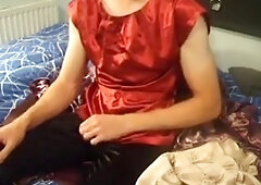 Cumming over red satin top