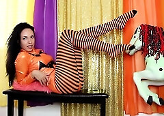 Slender brunette in nylons poses seductively on webcam