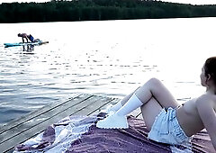 2 cuties took their clothing off on the lake. A passing surfer had sex in the open air.