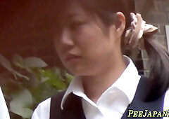 Japanese lady urinating outdoors