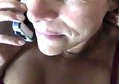 Hubby questions why she is moaning on the phone