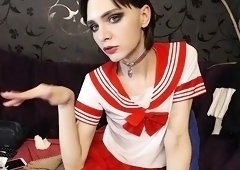 Nerdy brunette shemale in uniform strokes her lovely cock