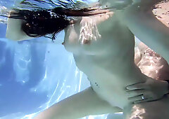 Underwater fucking with a major creampie