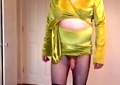 Lime green dress, fishnets and latex boots