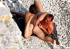 Beach pair enjoying sun and greater amount.