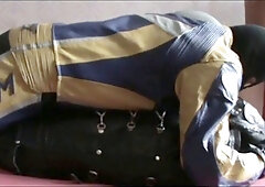 the slave in sleepsack with master in bikersuit