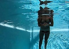 Beautiful mermaid Puzan Bruhova swims and kinda strips underwater