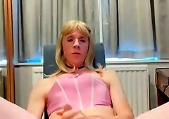 Cute sissy in pink lingerie teases her asshole