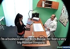 Sales female using a practical demonstration of her bulge lube - faux hospital