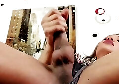 Glam shemale fingers her asshole while tugging on her shaft