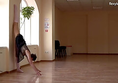 Super flexible Tonya making gymnasts positions before the camera.