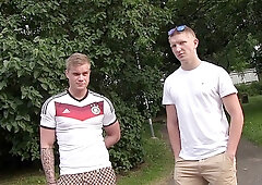 Two kinky footy fans fuck around in a threesome