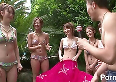 Beachside bikini fun turns hot as Asian girls take turns sucking and getting soaked