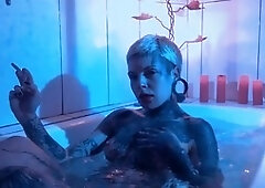 Hot tattooed babe Mari Zombie enjoys a steamy bath ritual with a big dildo