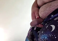 Chunky male pissing hard at home.