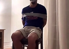 Gagged and duct taped to chair