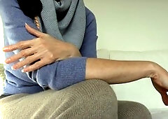 Elegant brunette Victoria Valente shows off her lovely hands and long nails in a cozy cashmere outfit