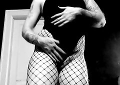 Sensual FTM dancer in sexy fishnets and high heels erotic performance