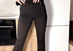 I stood in the kitchen wearing a sharp ebony office pantsuit and elegant white heels like a wicked little business pixie, spinning lazily and posing t