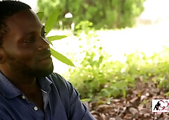 Dark-skinned couple lost in passion during outdoor encounters
