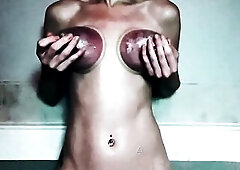 Pumping my cute titties and groaning as I play with my pierced teats and masturbate my snatch...