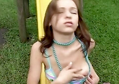 Sexy Hot Seline 18 enjoying play in the park. She strip off her shirts , touching her perfect tits and rub and finger her tight pussy