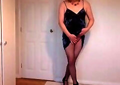 Blonde in foxy velvet dress, black fishnets and heels