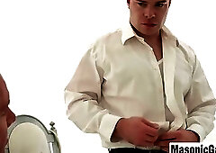 Businessman in White Suit Gives Intense Handjob to Muscular Man